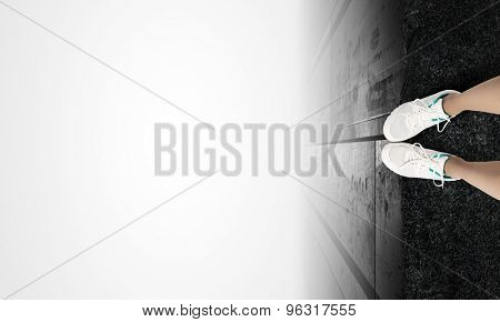Woman standing on the edge of the roof