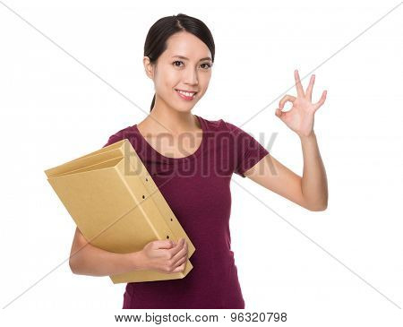 Asian young woman hodling with folder and ok sign gesture