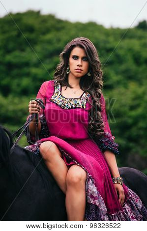 Beautiful gypsy in violet dress