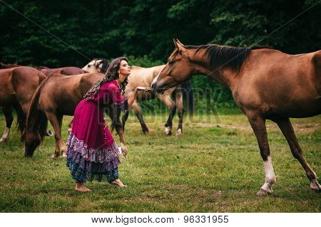 Beautiful gypsy in violet dress