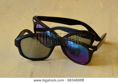 Retro black sunglasses on white background.  Vintage theme.