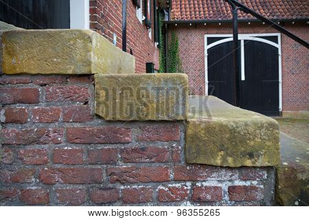 closeup of a stone stairs as part of an ancient watermill