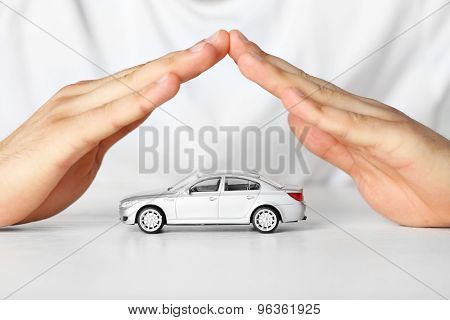 Male hands and car as protection of car concept