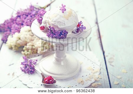 Beautiful composition with tasty ice cream and lilac flowers