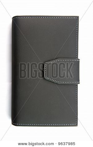 isolado do caderno de titular de couro falso preto no branco