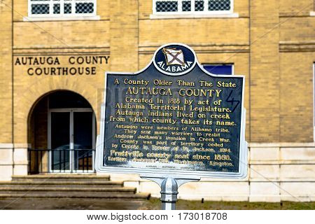 Prattville Alabama USA - January 28 2017: Side entrance to the Autauga County Courthouse with the Autauga County historic marker in the foreground.