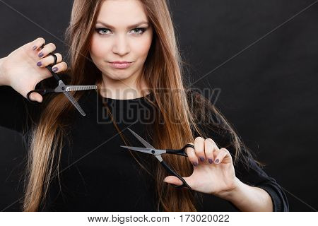 Elegance and classy. Fashion style of hairdo. Female professionalist with scissors. Elegant woman presents her hairdresser's saloon.
