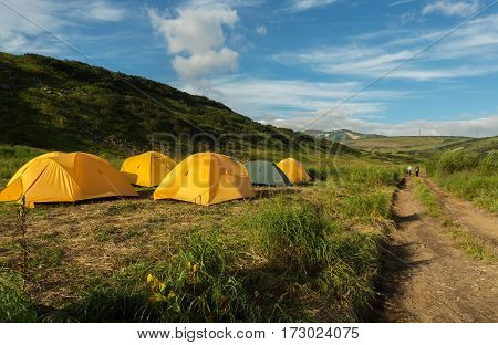 Campground in the brookvalley Spokoyny at the foot of outer north-eastern slope of caldera volcano Gorely.