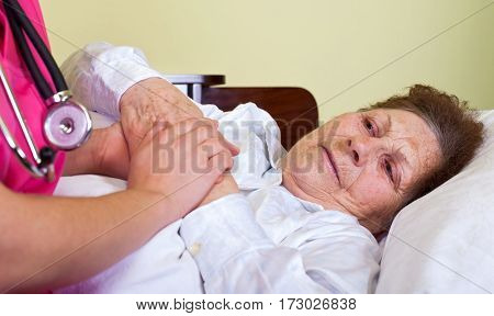 Picture of a bedridden elderly woman at home