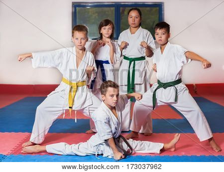Children during training in karate. Fighting position active lifestyle practicing fighting techniques