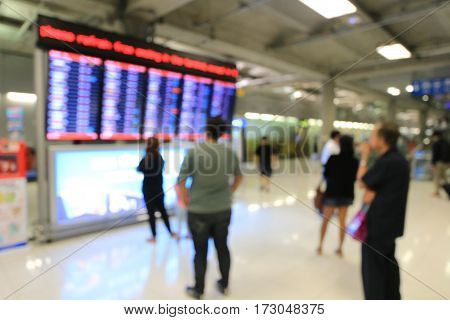 Blurred Image Of Business People In International Airport Terminal, Looking At Information Board, Ch