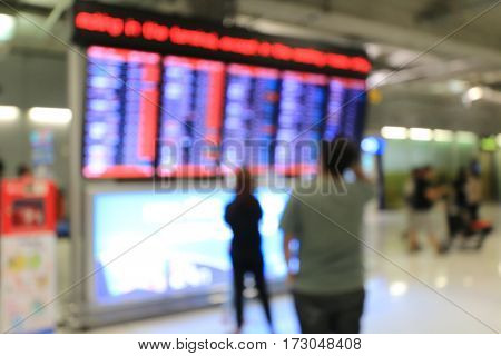 Blurred Image Of Business People In International Airport Terminal, Looking At Information Board, Ch