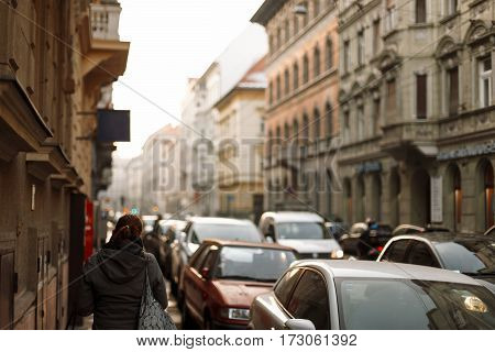 Woman walks on the street. Travel through the historic city in Europe. Budapest Hungary.