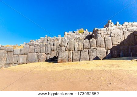 Inca Wall in SAQSAYWAMAN Peru South America. Example of polygonal masonry. The famous 32 angles stone in ancient Inca architecture.