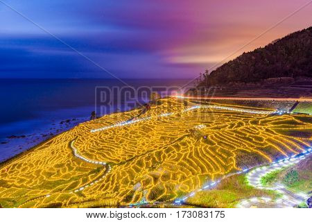 Wajima, Japan at Shiroyone Senmaida rice terraces at night.