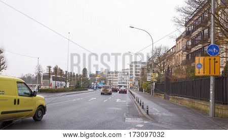 Grand Duchy of Luxembourg Luxembourg- January 032017: Citizens go on on his own business outside moving cars