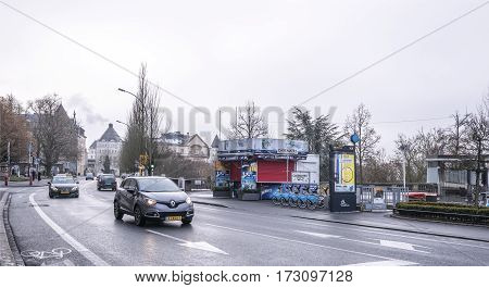 Grand Duchy of Luxembourg Luxembourg- January 032017: Citizens go on on his own business outside moving cars