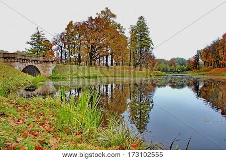 Beautiful romantic alley in a park with colorful trees and sunlight. autumn natural background Gatchina
