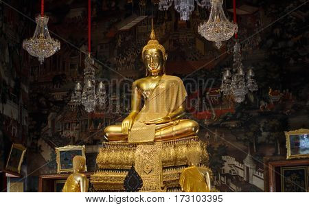 Golden buddha statue on temple Bangkok, Thailand.