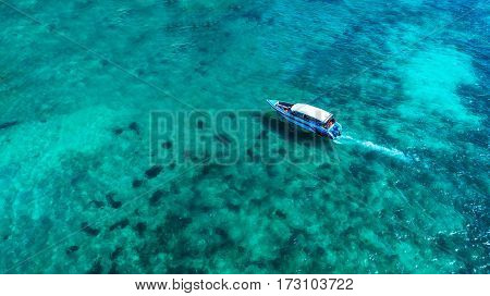 Speed boat in the sea.Aerial view. Top view.amazing nature background.The color of the water and beautifully bright.