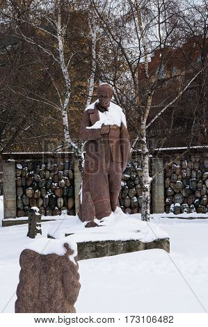 Moscow, Russia - January 17, 2017: The monument to Joseph Stalin in the background sculpture Victims of Repression in Muzeon park in Moscow
