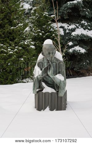 Moscow, Russia - January 17, 2017: The sculpture of Mahatma Gandhi in a park in Moscow winter Muzeon