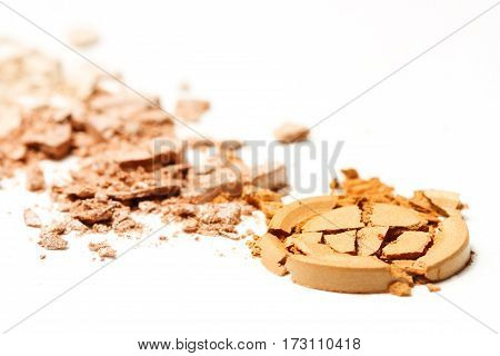 Gold beige eye shadow crushed cosmetic isolated on white background.Beauty fassion and style.