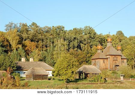 Antique hut and wooden church in Pirogovo Kiev Ukraine
