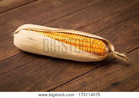 yellow corn feed for rabbit and pigs on wooden table