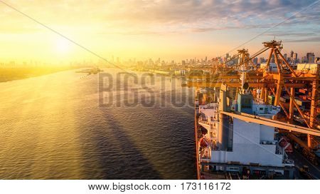 container ship in import export and business logistic.By crane Trade Port Shipping.cargo to harbor.Aerial view.Water transport.International.Shell Marine.Top view.