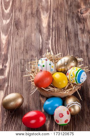 Colorful easter edds on a brown wooden table