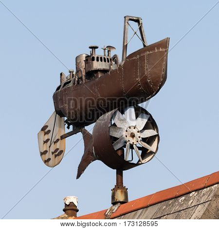 Cardiff Wales UK - February 18 2017: Trawler weathervane by Andrew Hazell. Public artwork created in 1997 on display on roof in Stuart Street on Cardiff Bay