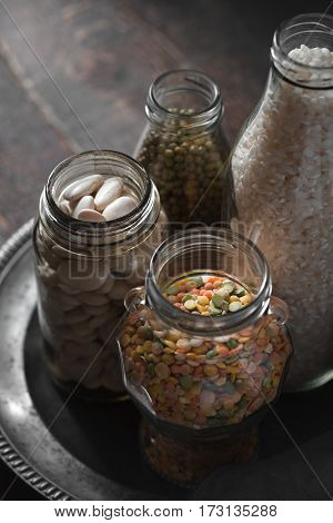 White beans, green beans, lentils and rice side view vertical