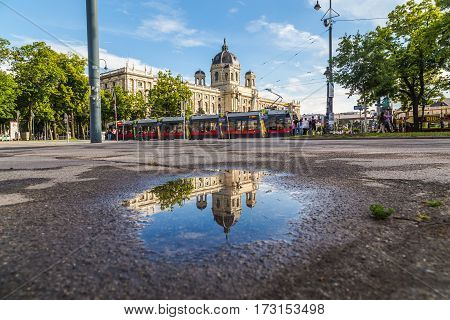VIENNA AUSTRIA - 12TH JUNE 2016: The outside of the KH Museum in Vienna. A red tram and people can be seen.