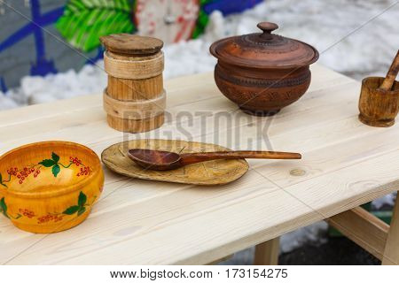one old wooden spoon and table background