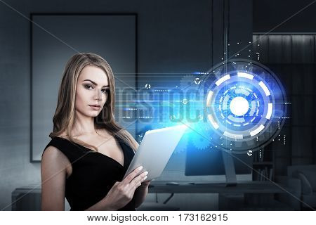 Portrait of a businesswoman with a tablet computer standing in an office with a circle and gears sketch drawn on a glassboard. Toned image.