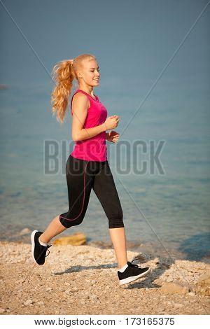 Jogging In Th Beach - Woman Runns Near Sea On Early Summer Morning