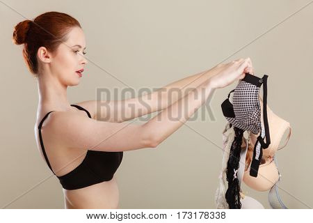 Woman Choosing Bras To Wear