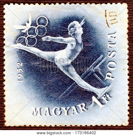 HUNGARY - CIRCA 1952: Postage stamp printed in Hungary  with a picture of a gymnastics, from the series 