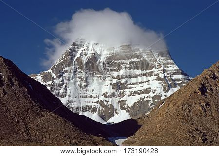 Cloud on the top of of sacred Mount Kailash early in the morning.
