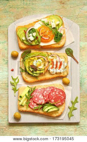 Toast with cream cheese ricotta herbs sausage avocado egg cucumber tomato spinach onion