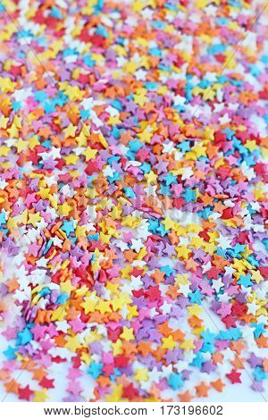 bright colored confectionery sprinkling soft focus blur