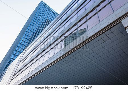 directly below view of modern office block building in ShenzhenChina.