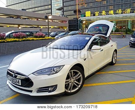 Chek Lap Kok, Hong Kong - February 8, 2016: An electric vehicle model S of the brand Tesla Motors parked at the airport in Chek Lap Kok, Hong Kong.