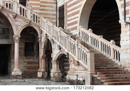Staircase of reason in courtyard the Palazzo della Ragione. Verona Italy