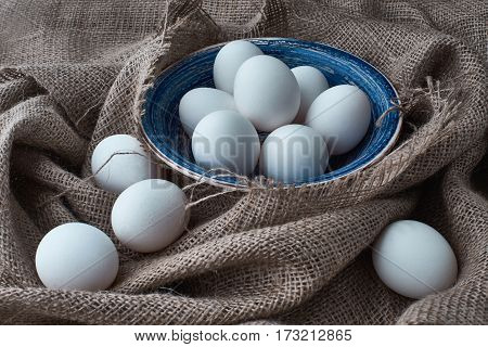 Ecological natural fresh eggs collected in the plate for cooking