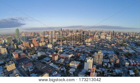 Cityscape with Dutch Kills quarter, Queensboro Bridge and Manhattan skyscrapers at summer evening. Aerial view