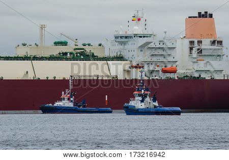 GAS CARRIER - Tugs support an LNG carrier for docking terminal in Swinoujscie