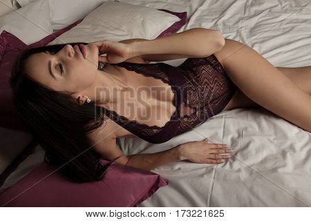 Boudoir Photo Of Sexy Girl Wearing Stylish Purple Lingerie Underwear Posing In The Bedroom
