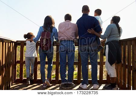 Multi Generation Family Standing On Outdoor Observation Deck
